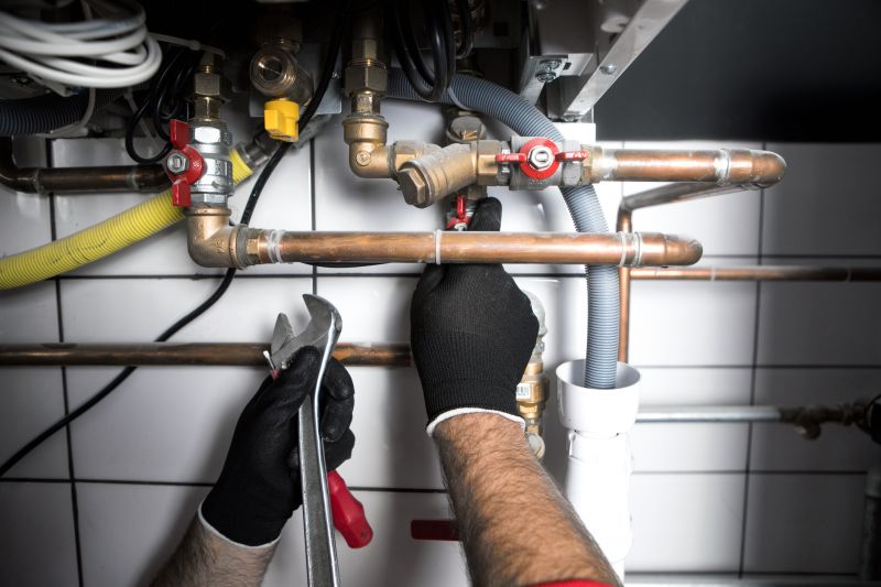 Plumber Fixing a Pipe